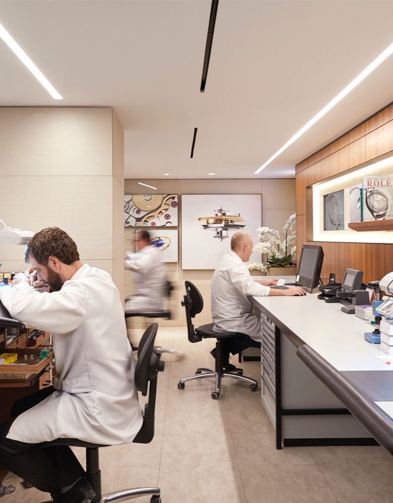 People working at a Rolex Authorized Service Center