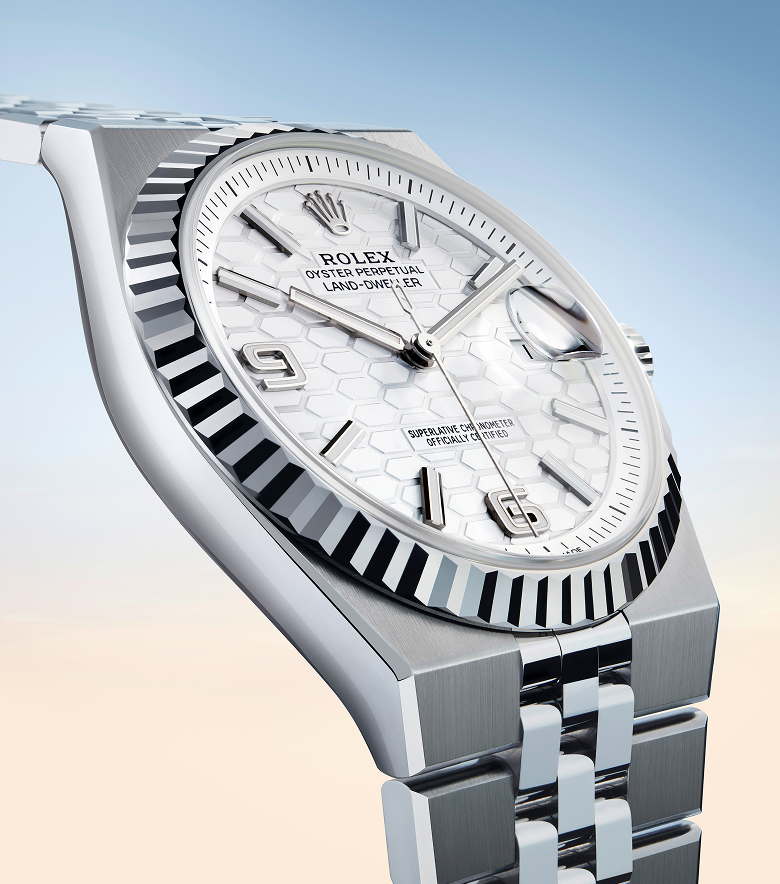 A close-up of the Rolex Land-Dweller watch showing the honeycomb motif