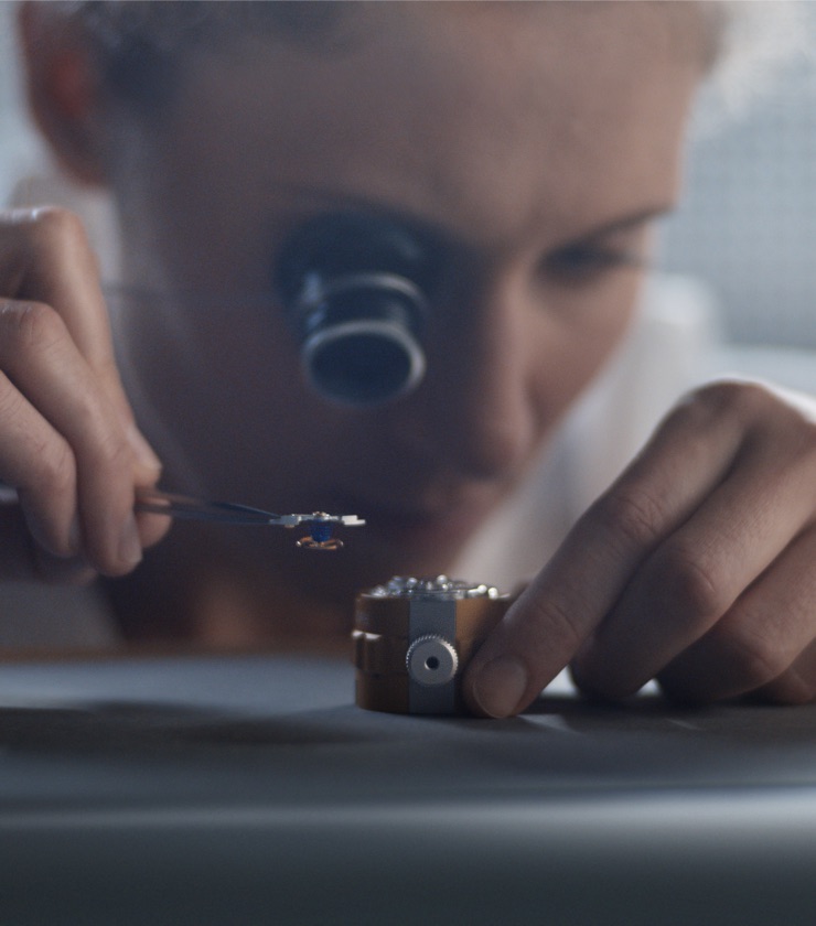 Man overlooking the watchmaking process
