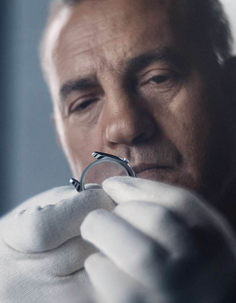 Man looking at a watch case